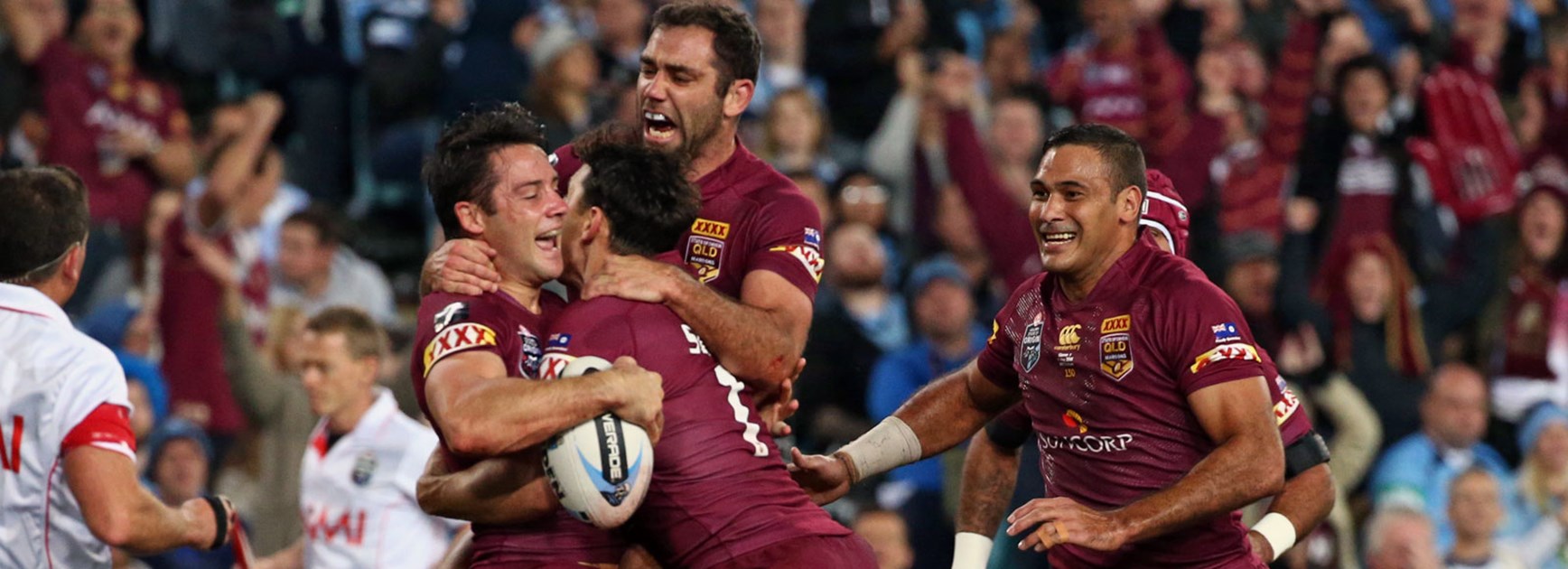 Maroons players celebrate Cooper Cronk's first-half try in Game One.