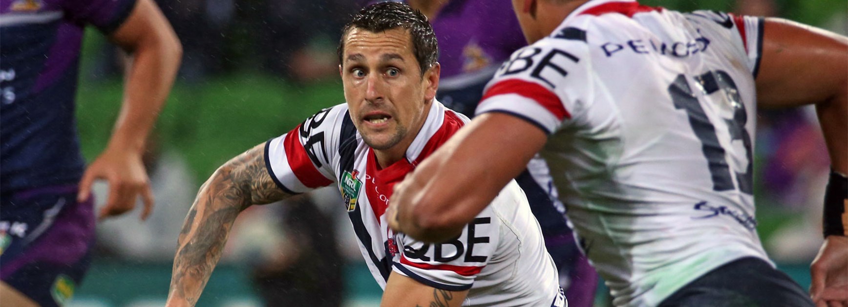 Mitchell Pearce shapes to pass against the Storm on Saturday.