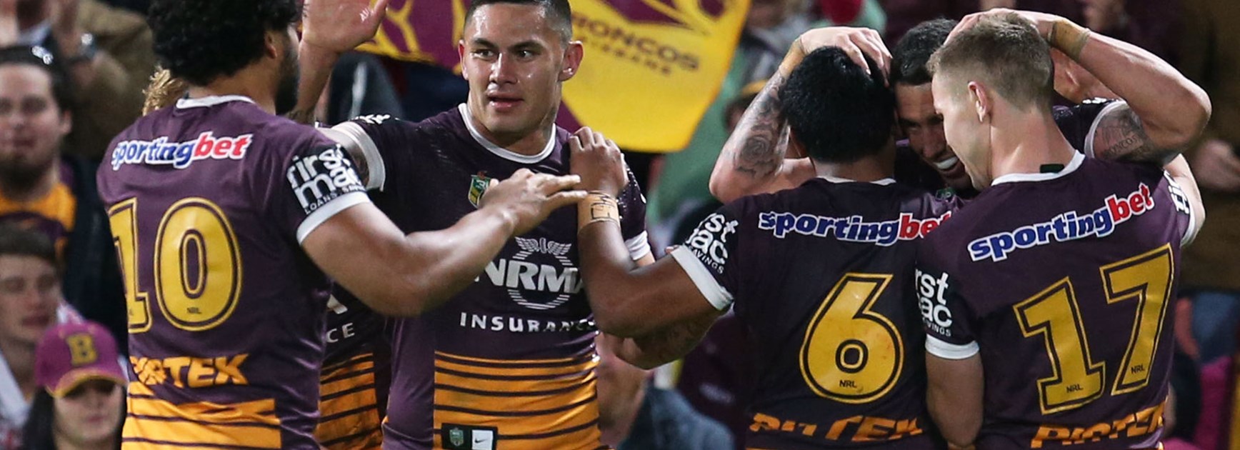 Broncos players celebrate during their big Round 13 win over the Sea Eagles.