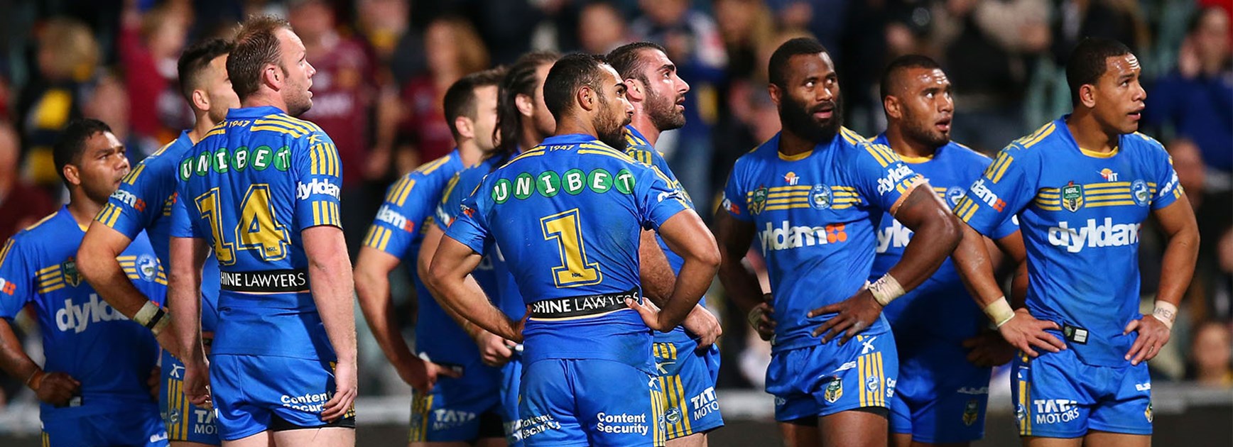 Parramatta players look on dejected after giving up a 24-point lead against the Cowboys in Round 13.