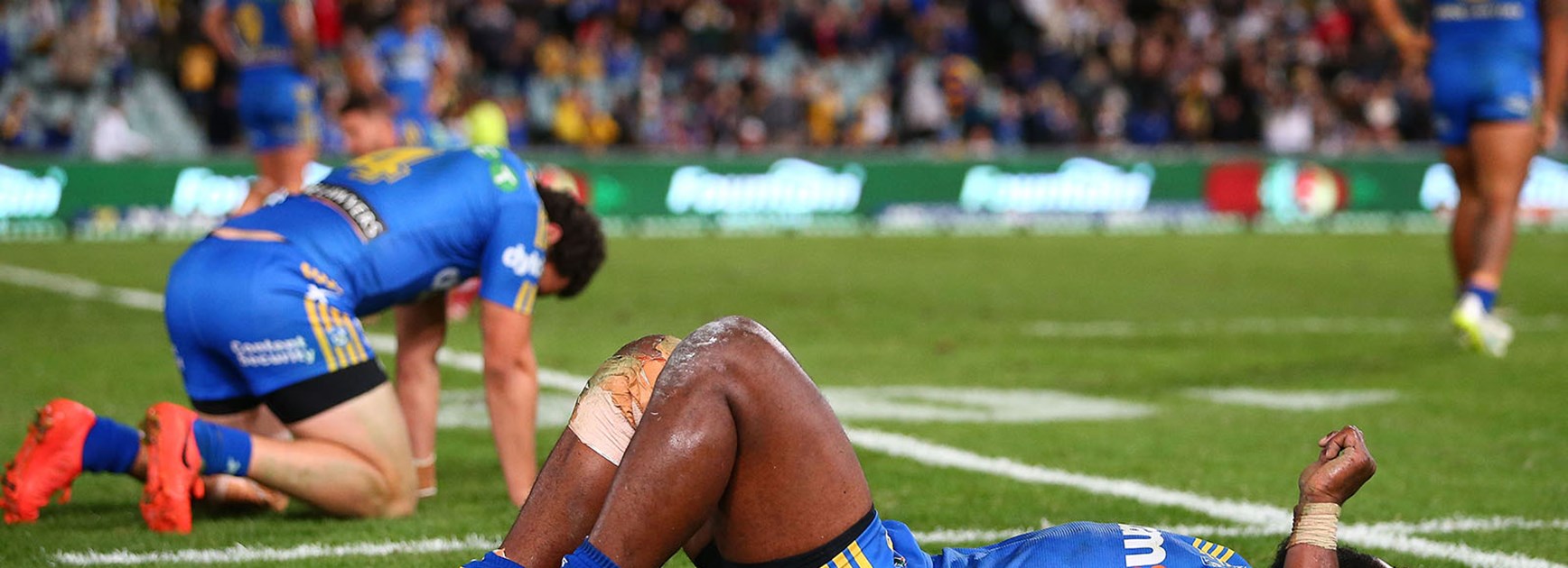Parramatta players sprawled across Pirtek Stadium after throwing away a 24 point lead against the Cowboys in Round 13.