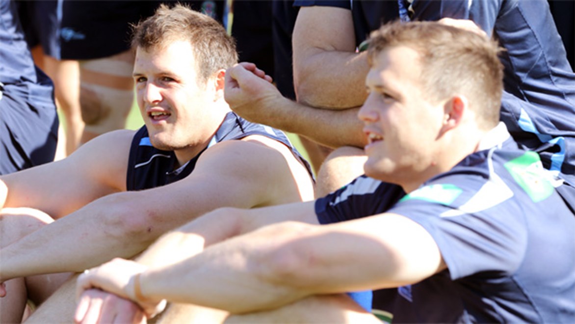 The Morris twins are happy to play opposite sides of the field for the NSW Blues in Origin II.