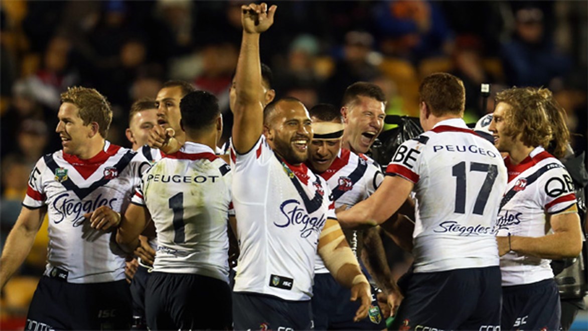 The Roosters celebrate Blake Ferguson's match-winning try against the Warriors on Saturday night.