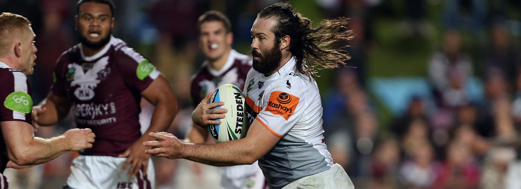 Wests Tigers prop Aaron Woods charges forward during his side's clash with Manly at Brookvale Oval.