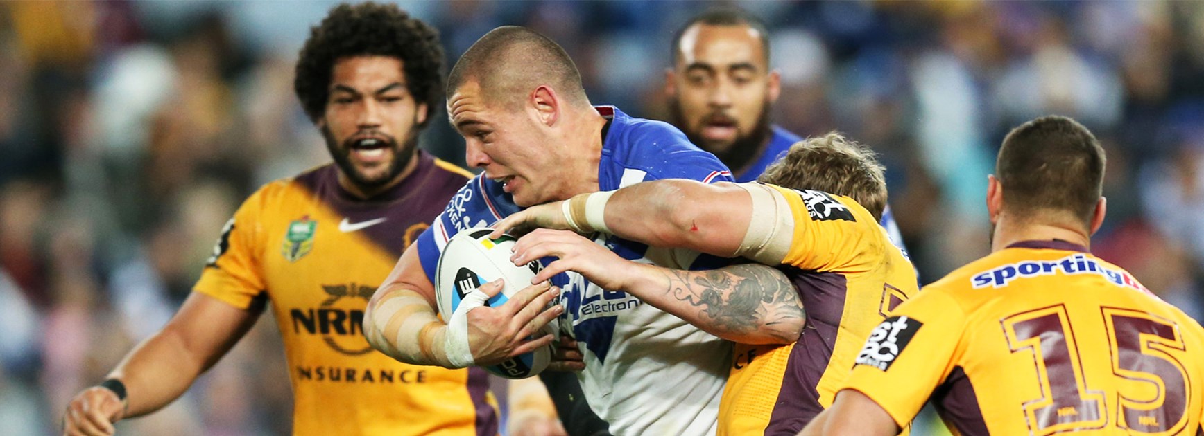 Bulldogs prop David Klemmer is wrapped up by the Brisbane defence.