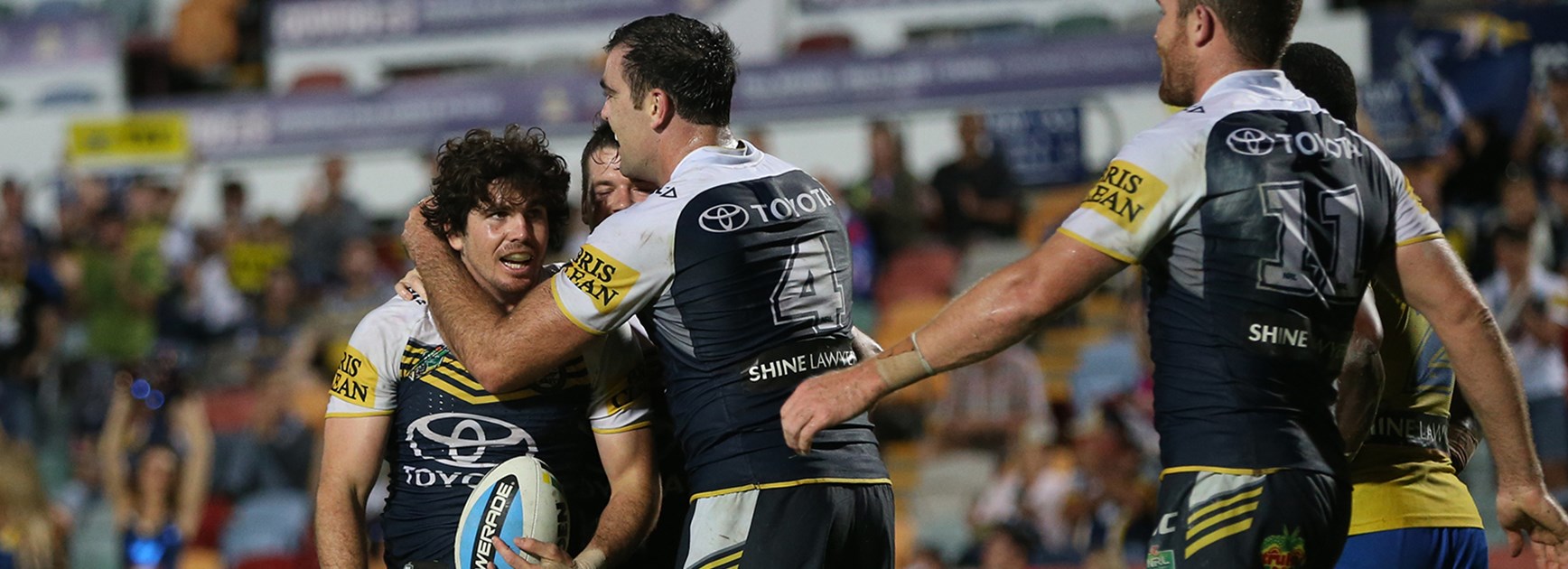 Cowboys players celebrate another try against the Eels in Round 20.