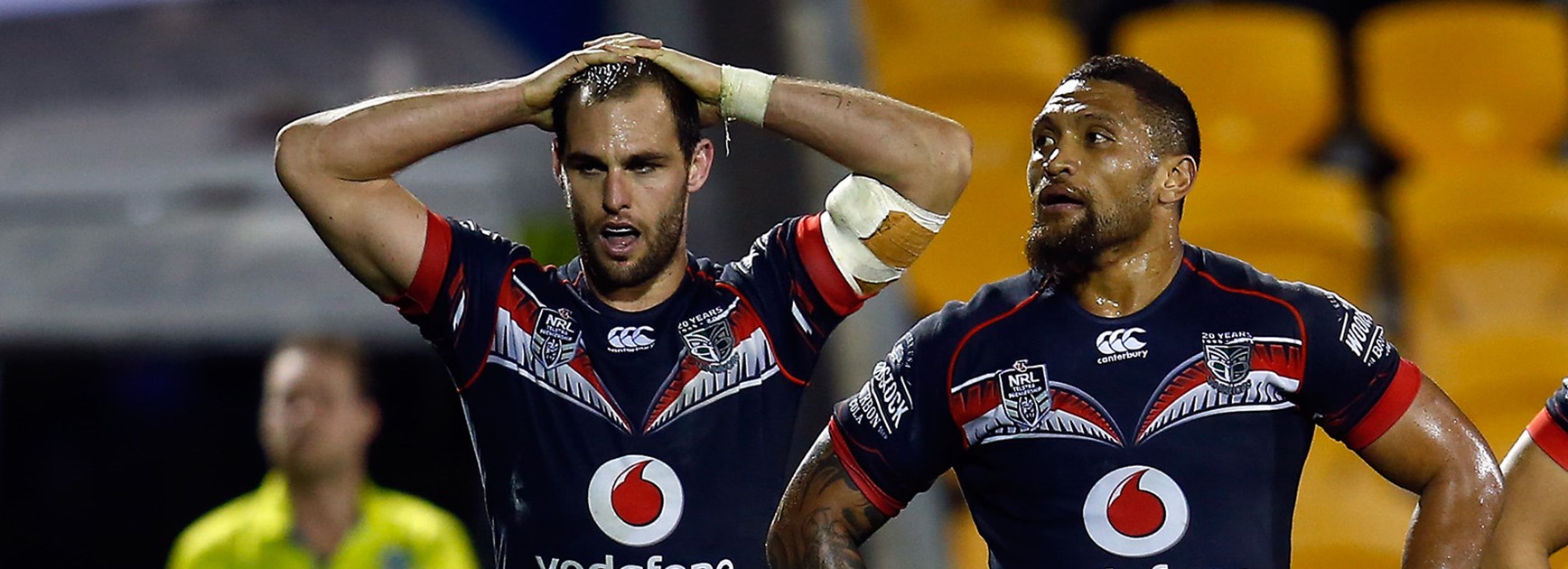 Warriors players look on dejected after giving up a lead to lose to the Sharks.