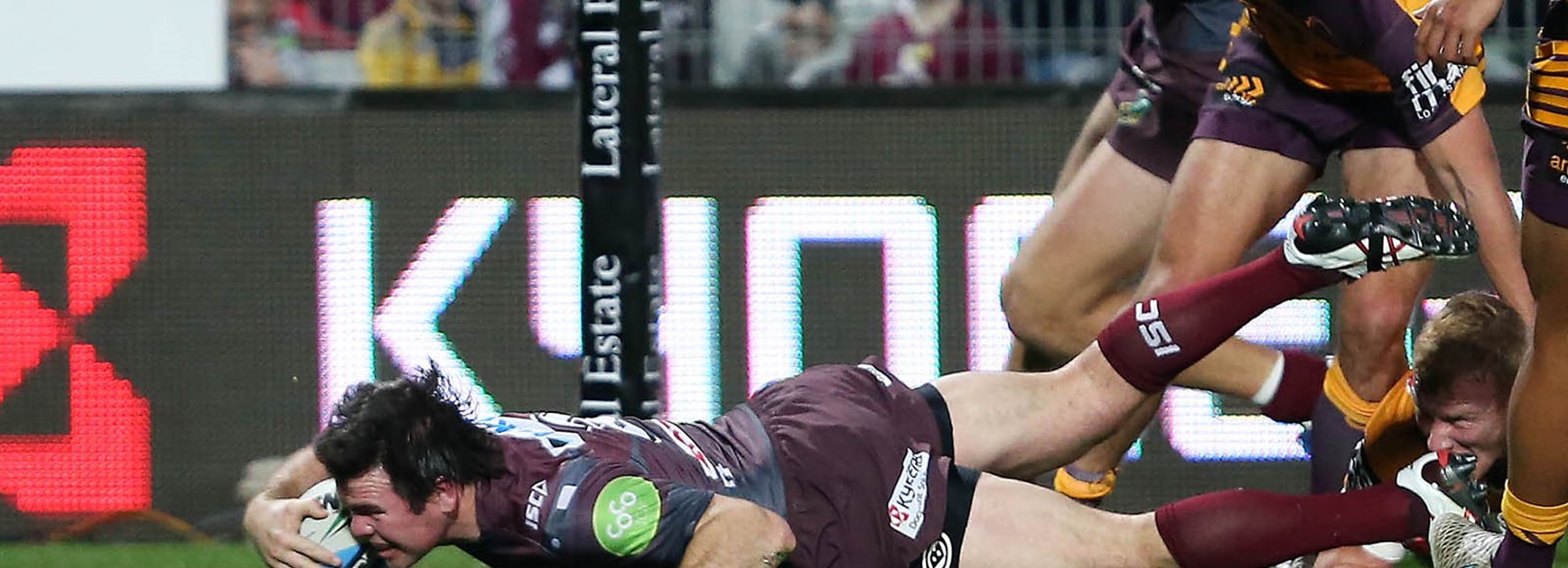 Jamie Lyon scores for Manly against the Broncos.
