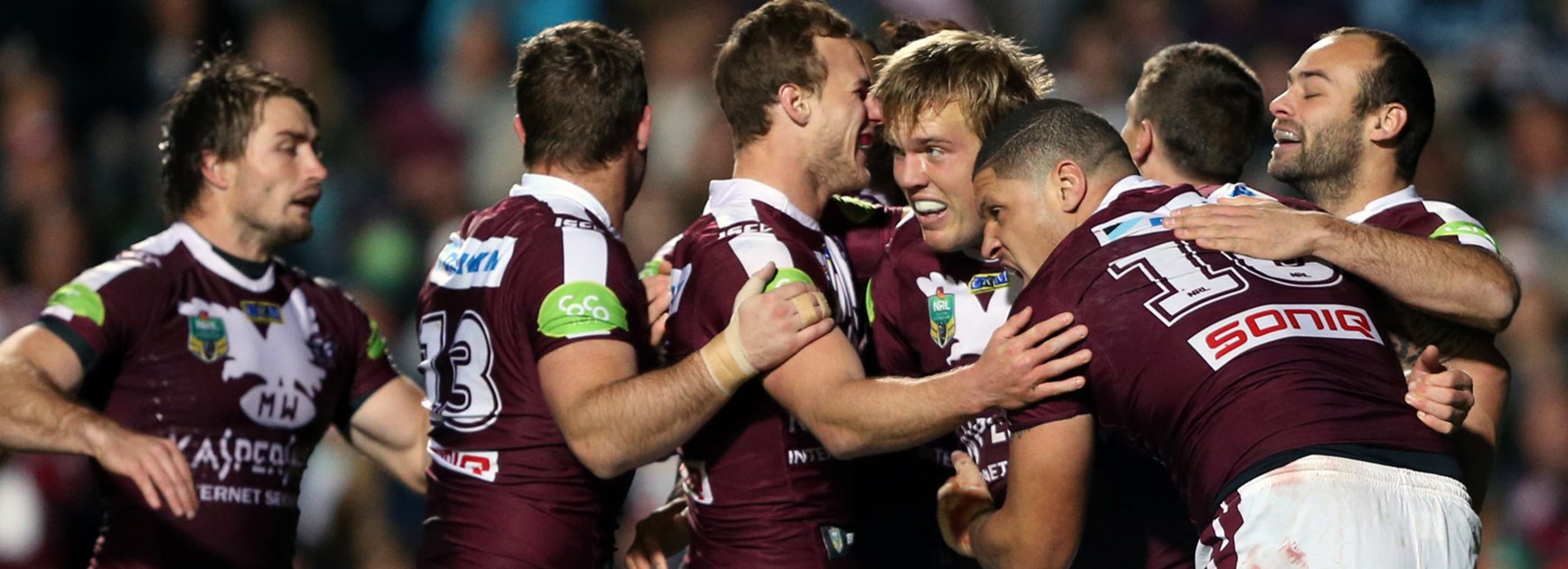 Manly players celebrate during their Round 22 win over the Rabbitohs.