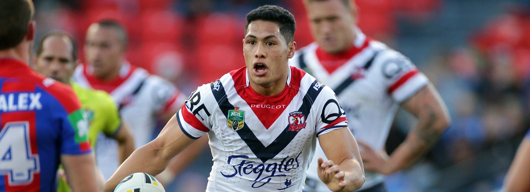 Roger Tuivasa-Sheck makes a break against the Knights in Newcastle.