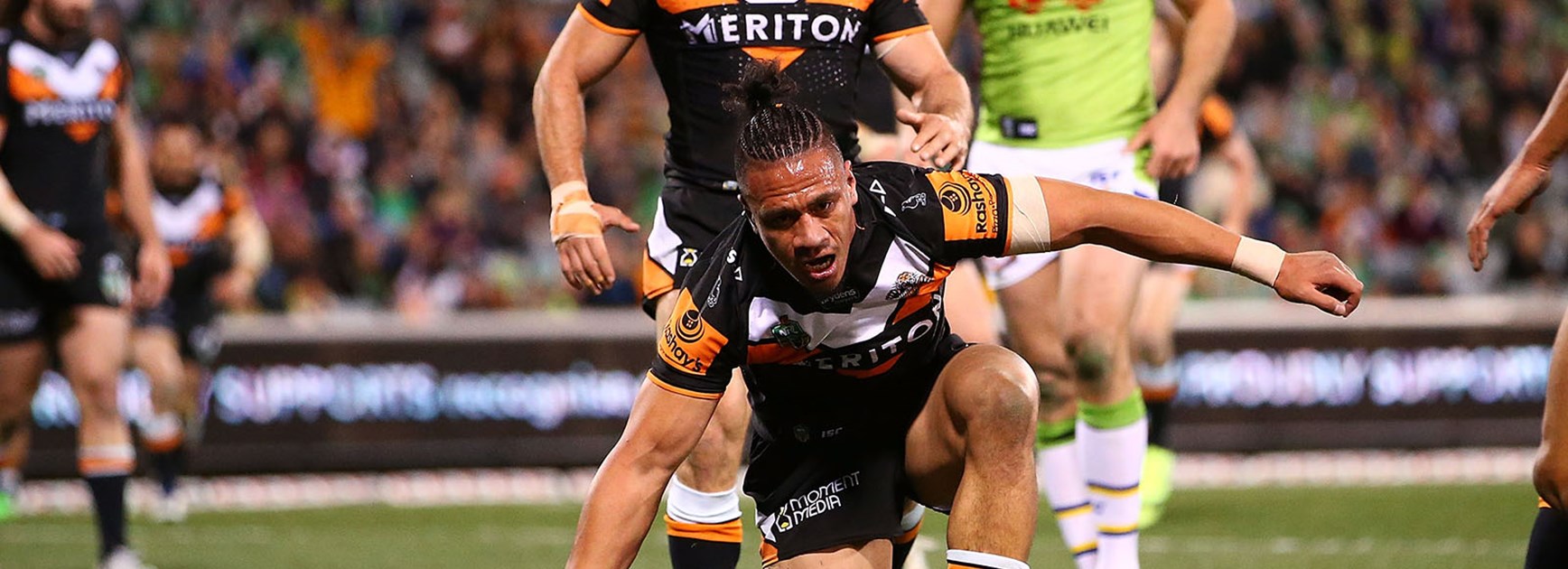 Sauaso Sue scores the opening try for the Wests Tigers in Canberra.