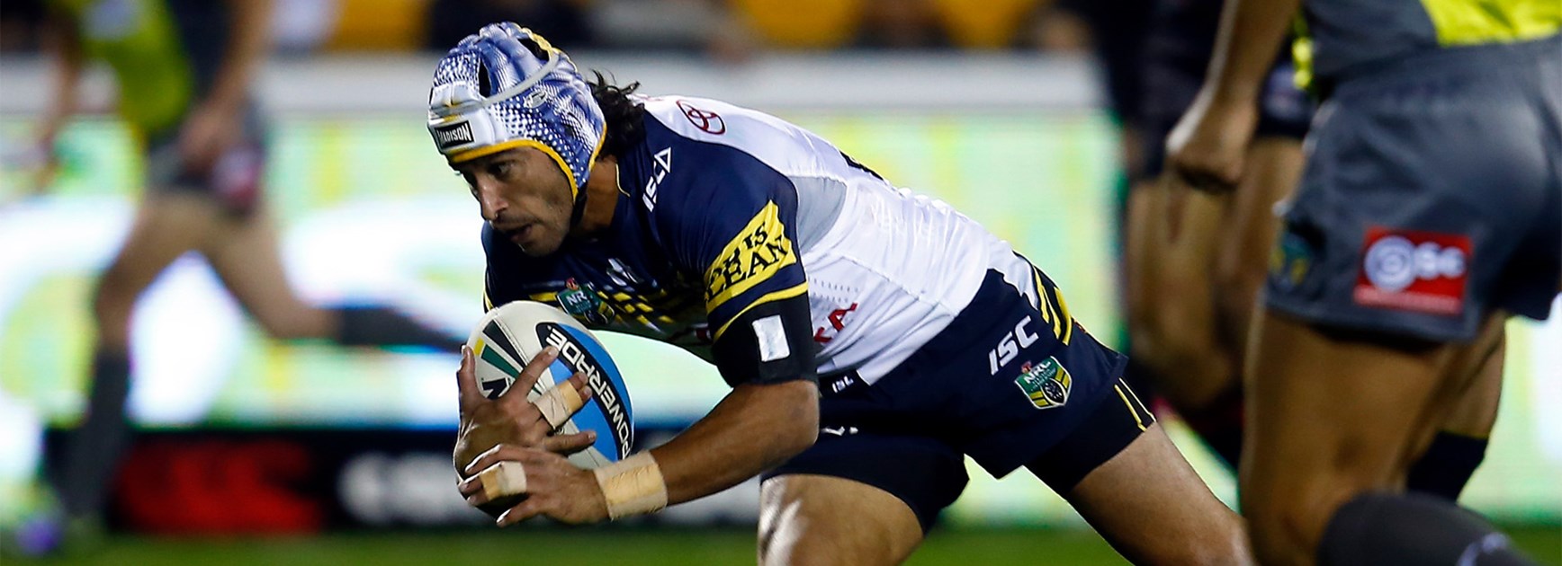 Johnathan Thurston dives over to score for the Cowboys against the Warriors on Saturday night.