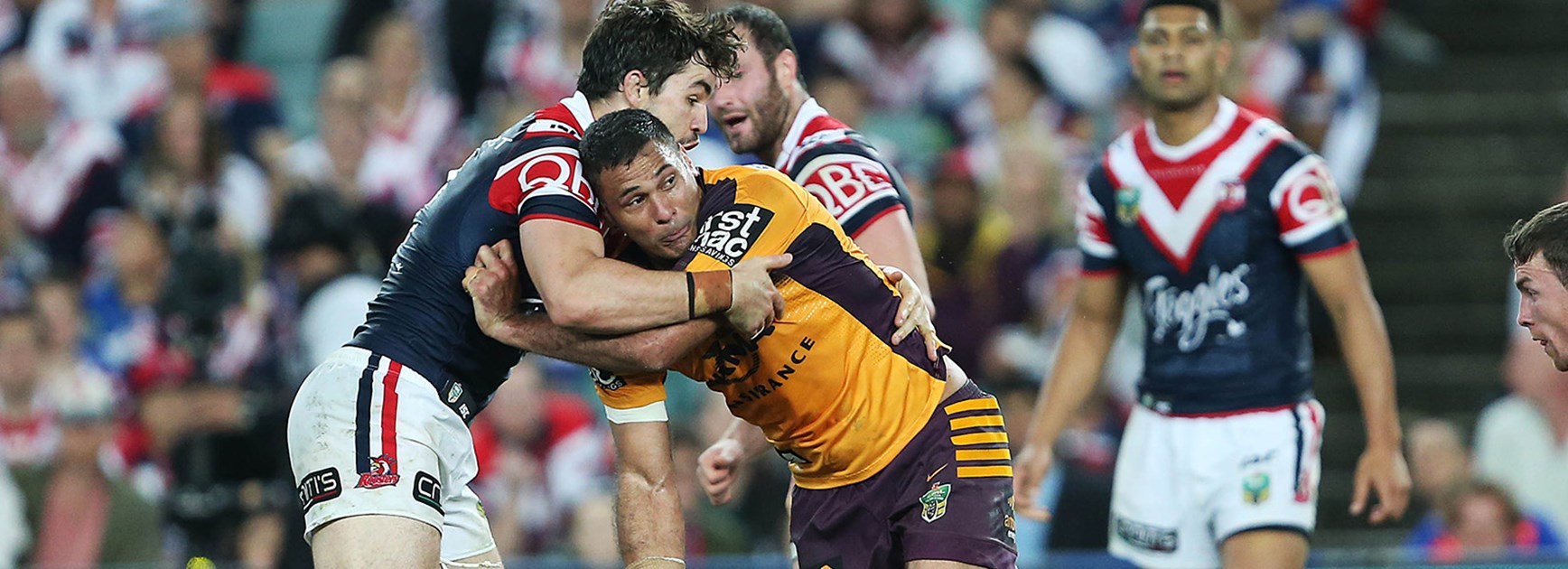 Broncos captain Justin Hodges looks to offload against the Roosters in Round 24.