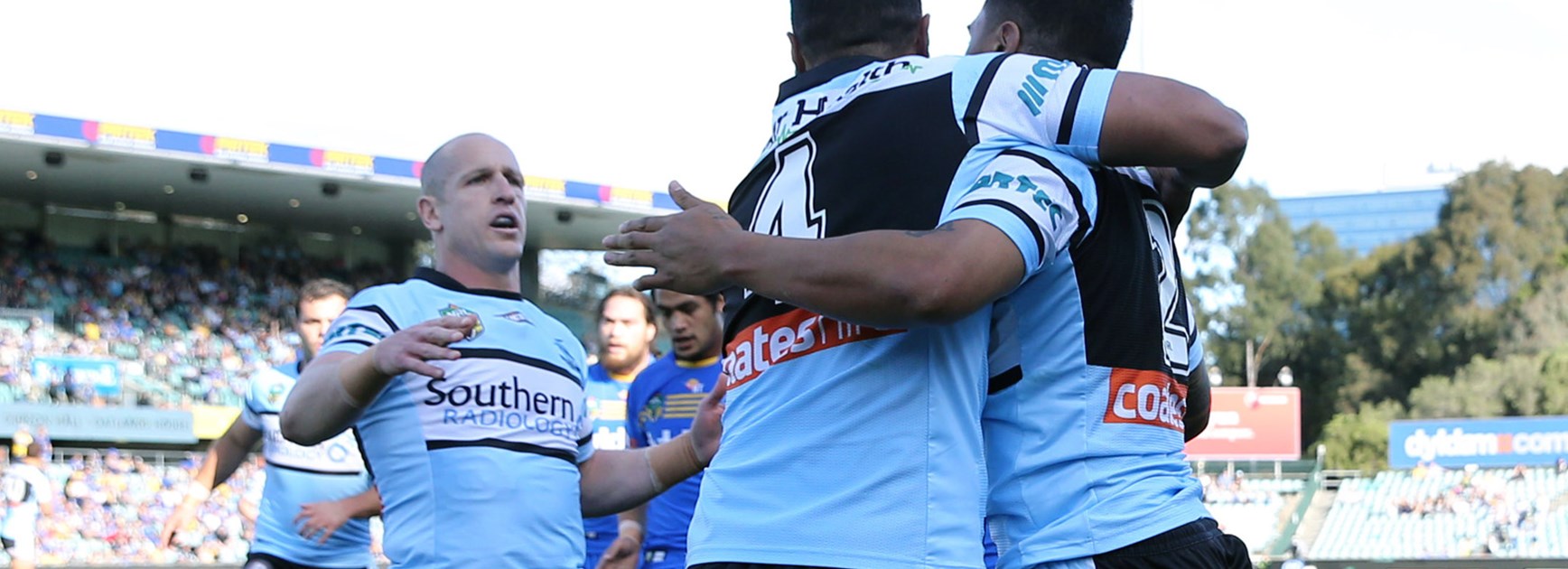 The Sharks celebrate Sosaia Feki's first-half try.