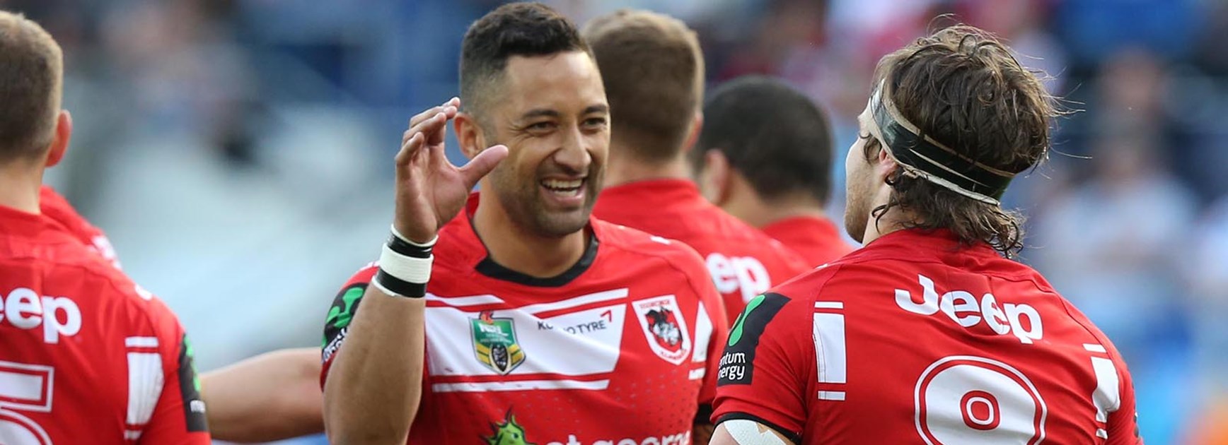 Benji Marshall and Mitch Rein celebrate after a try against the Titans.