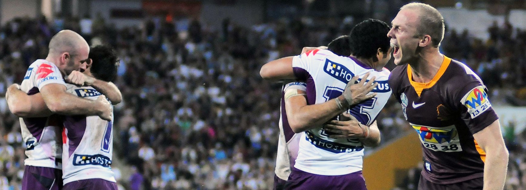 Darren Lockyer screams in anguish as Adam Blair (No.15) celebrates with his Storm teammates after their 16-14 win in the 2008 semi-final.