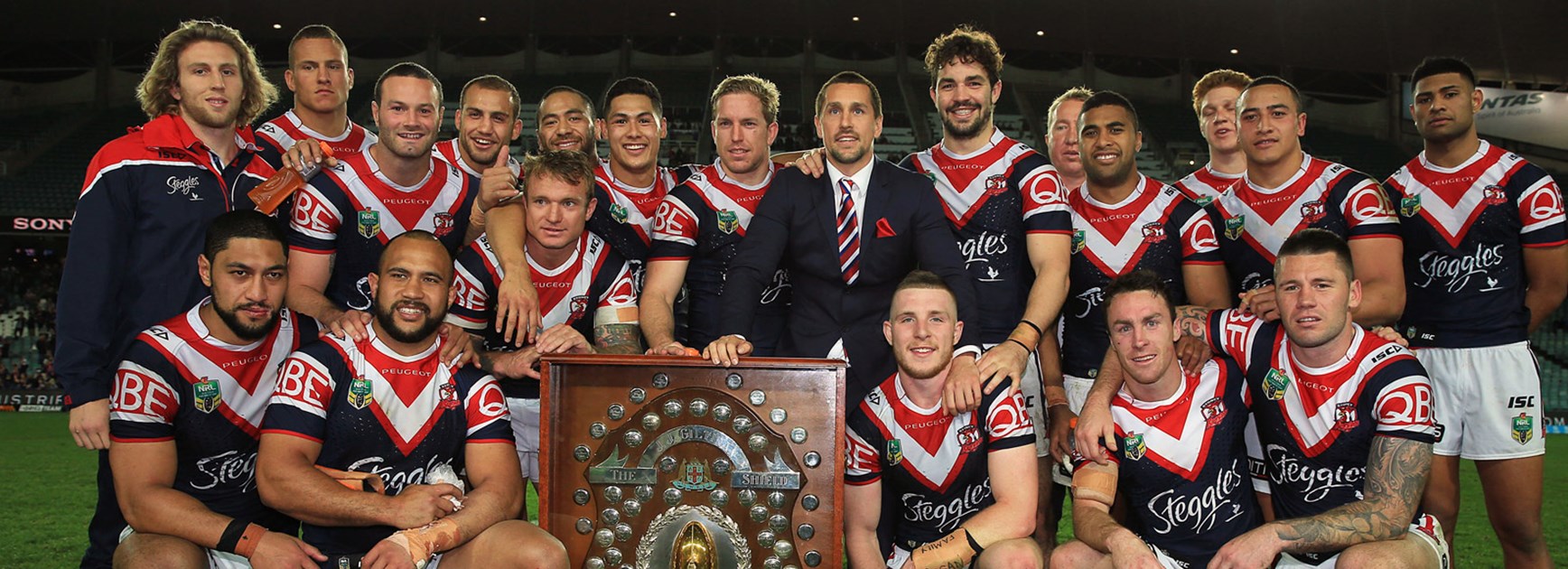 Roosters players with the JJ Giltinan Shield following their win over South Sydney.