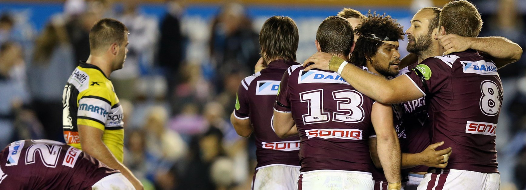 Sea Eagles players celebrate during their tight win over the Sharks.