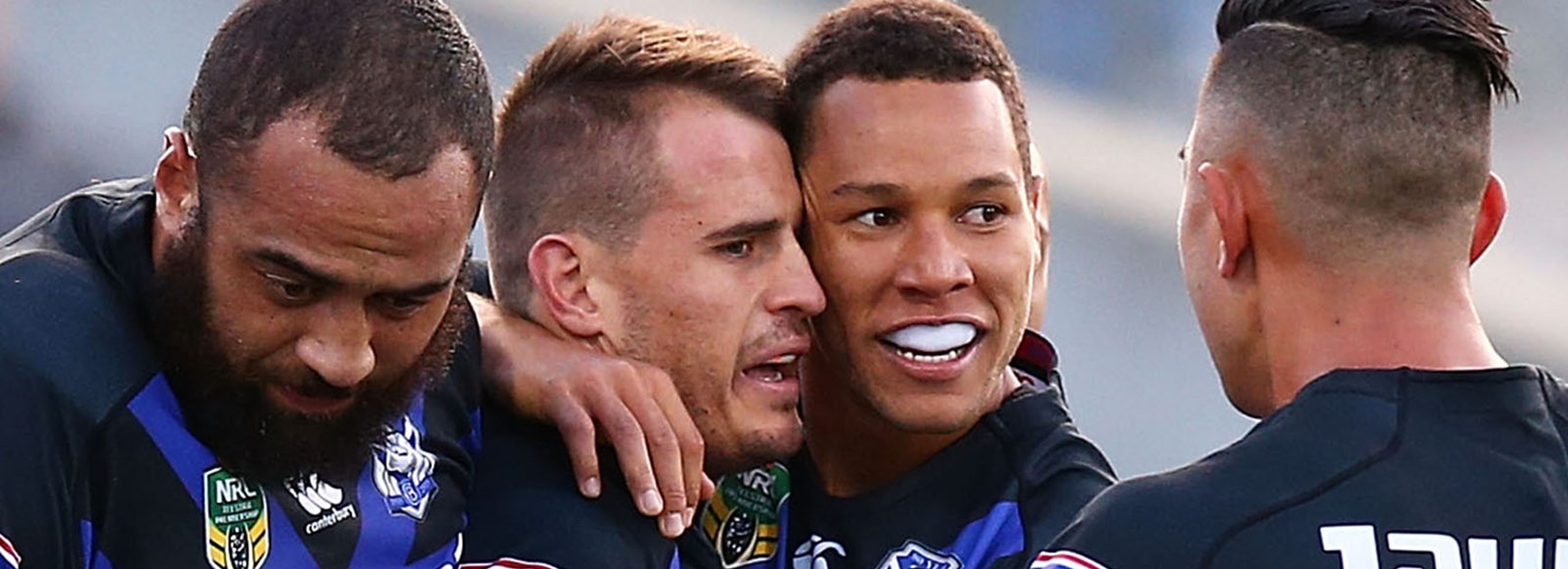 Josh Reynolds and Moses Mbye celebrate another Bulldogs victory.