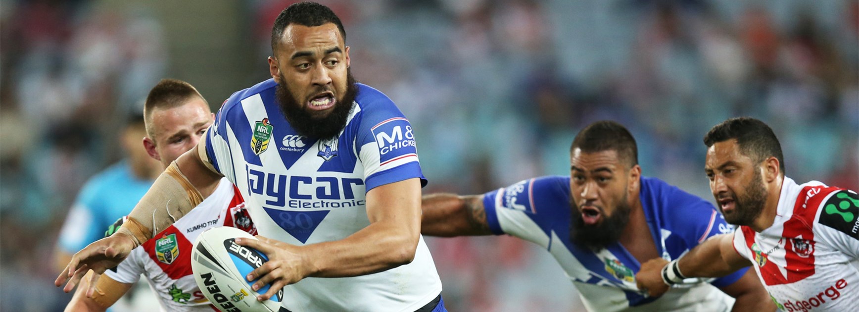 Bulldogs prop Sam Kasiano makes a charge against the Dragons.