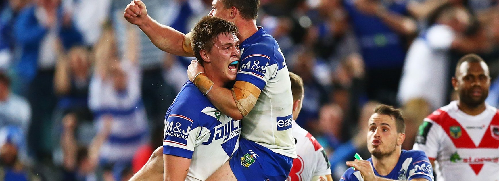 The Bulldogs celebrate Shaun Lane's try against the Dragons.