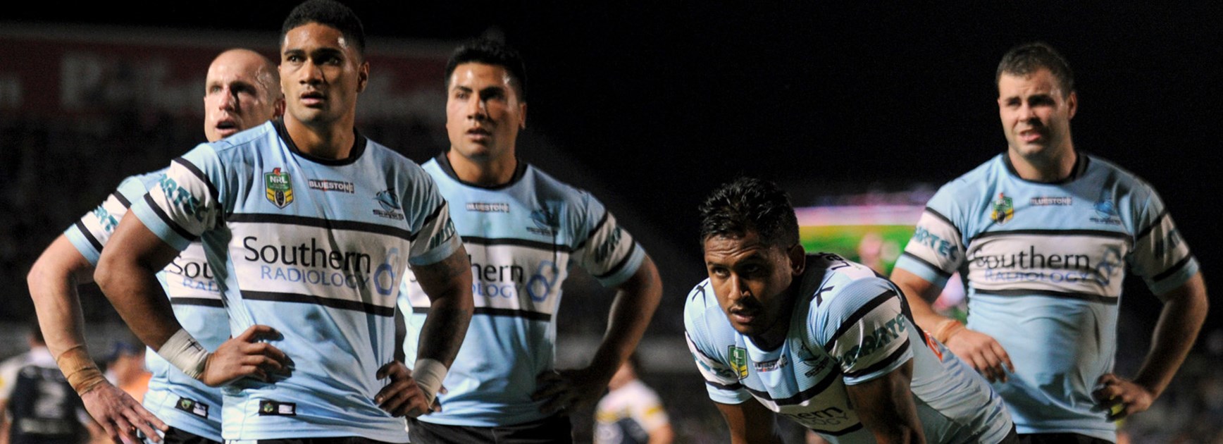 Sharks players look on dejected in their semi-final loss to the Cowboys.