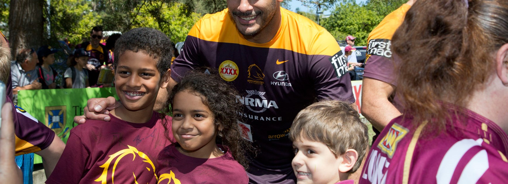 Justin Hodges poses with Broncos fans ahead of the club's home preliminary final on Friday night.