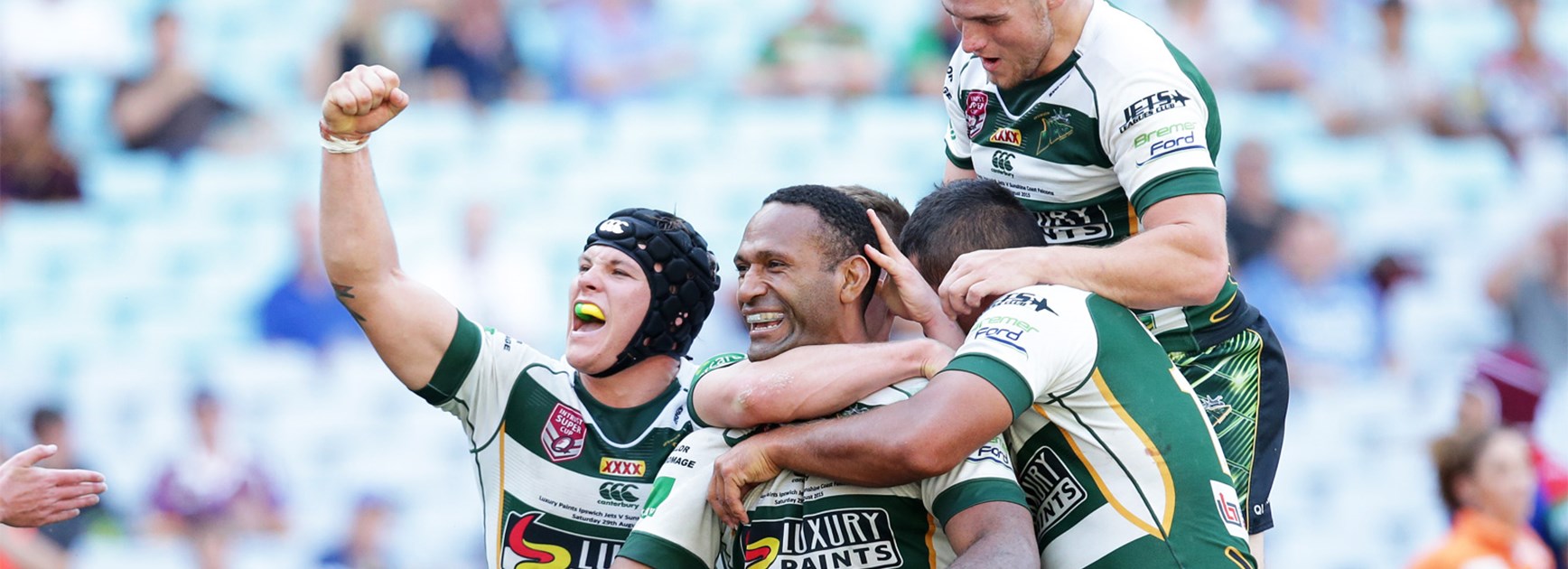 The Ipswich Jets celebrate Rod Griffin's try in their State Championship win over Newcastle.