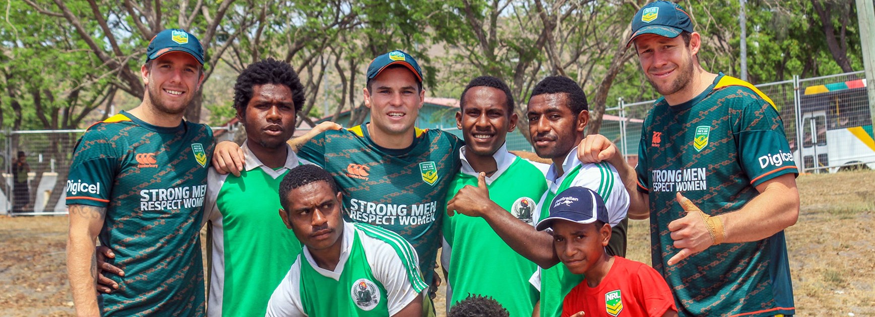 Australian Prime Minister's XIII representatives Kane Elgey, Daniel Mortimer and Jeremy Latimore participate in a League Bilong Laif schools rugby league clinic in Port Moresby.