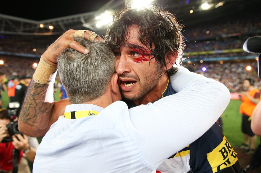 Johnathan Thurston and Paul Green embrace after the 2015 grand final.