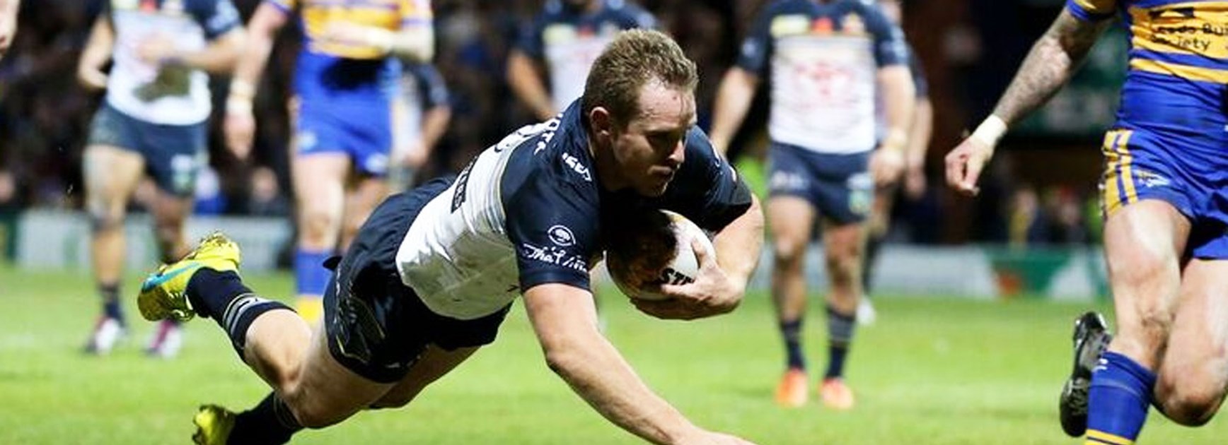 Michael Morgan scores for the Cowboys against Leeds in the World Club Challenge.