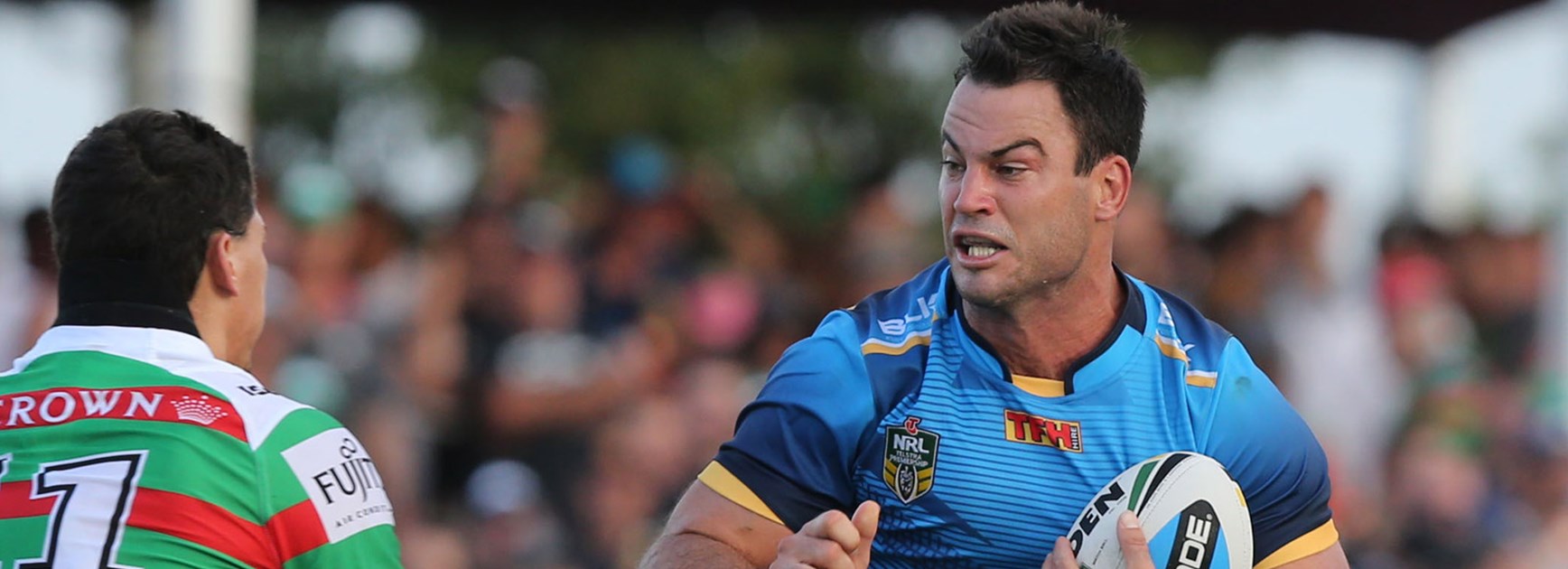 Titans recruit David Shillington charges into the South Sydney defence in Gold Coast's trial loss.