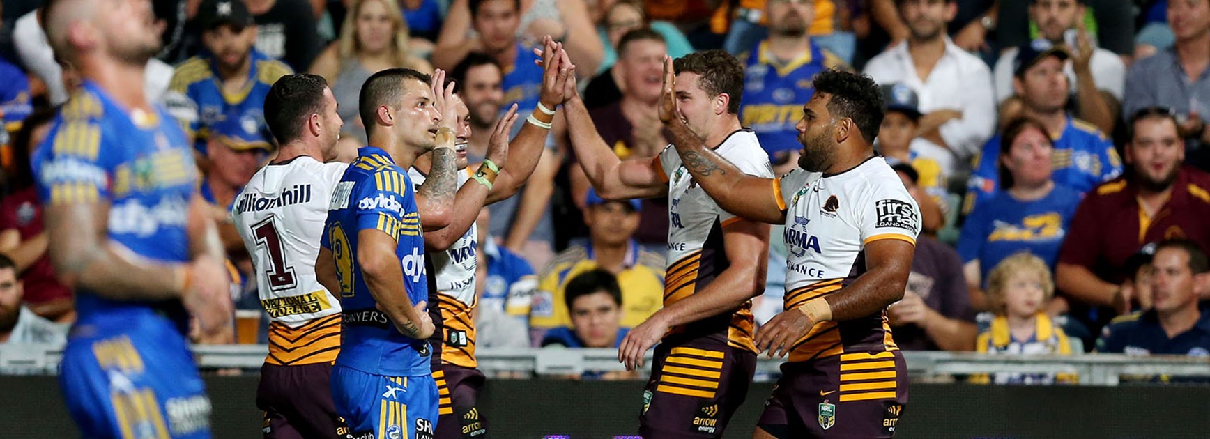 The Broncos celebrate a try against the Eels in Round 1.