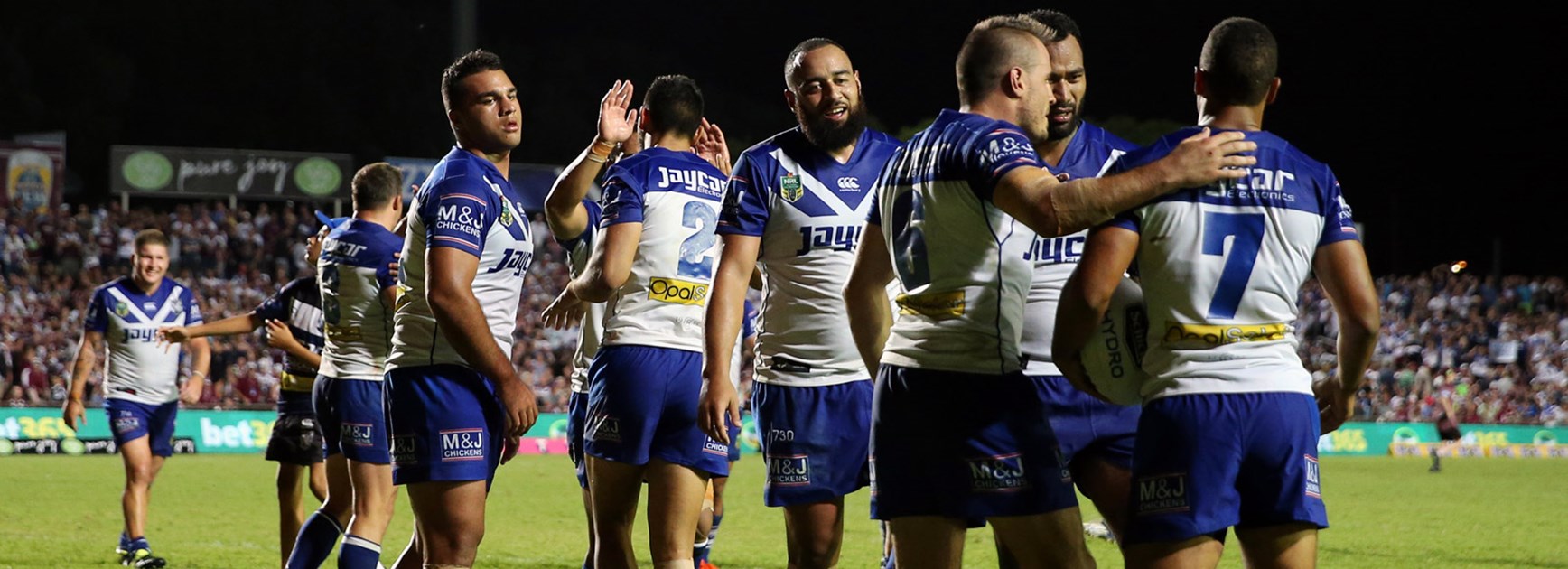 Bulldogs players celebrate during their impressive Round 1 win over Manly.