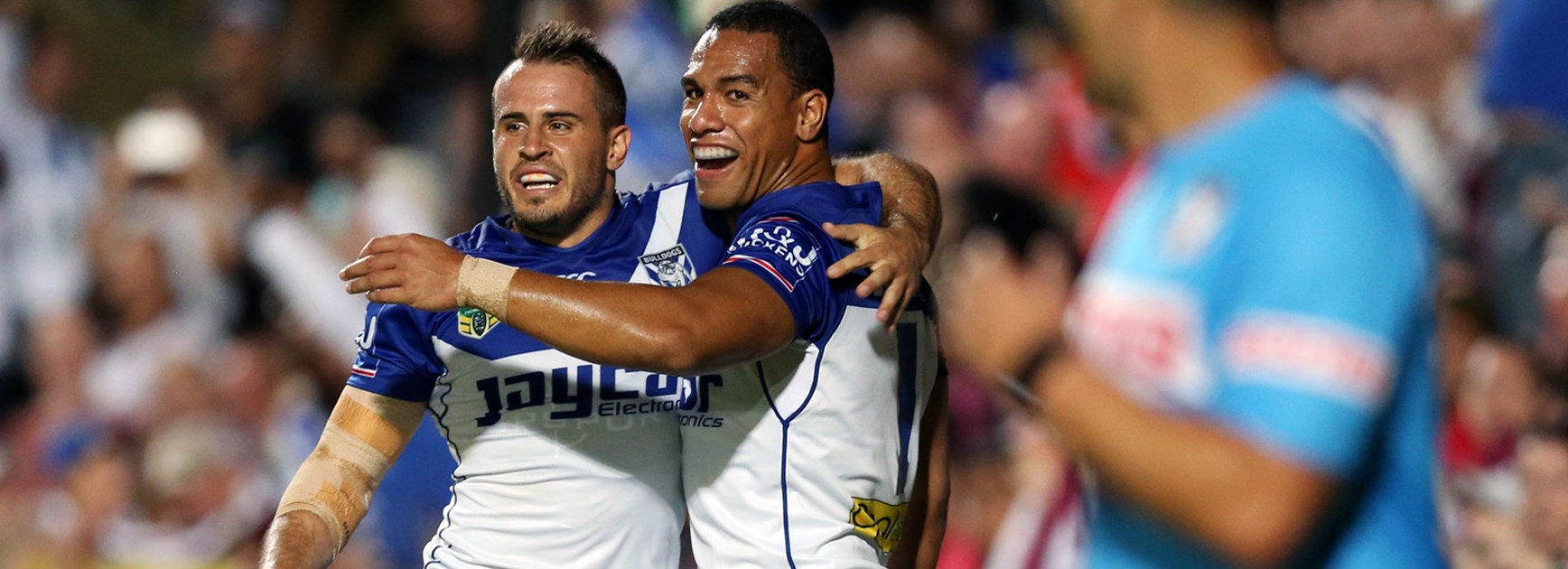 Josh Reynolds and Will Hopoate celebrate against Manly in Round 1.