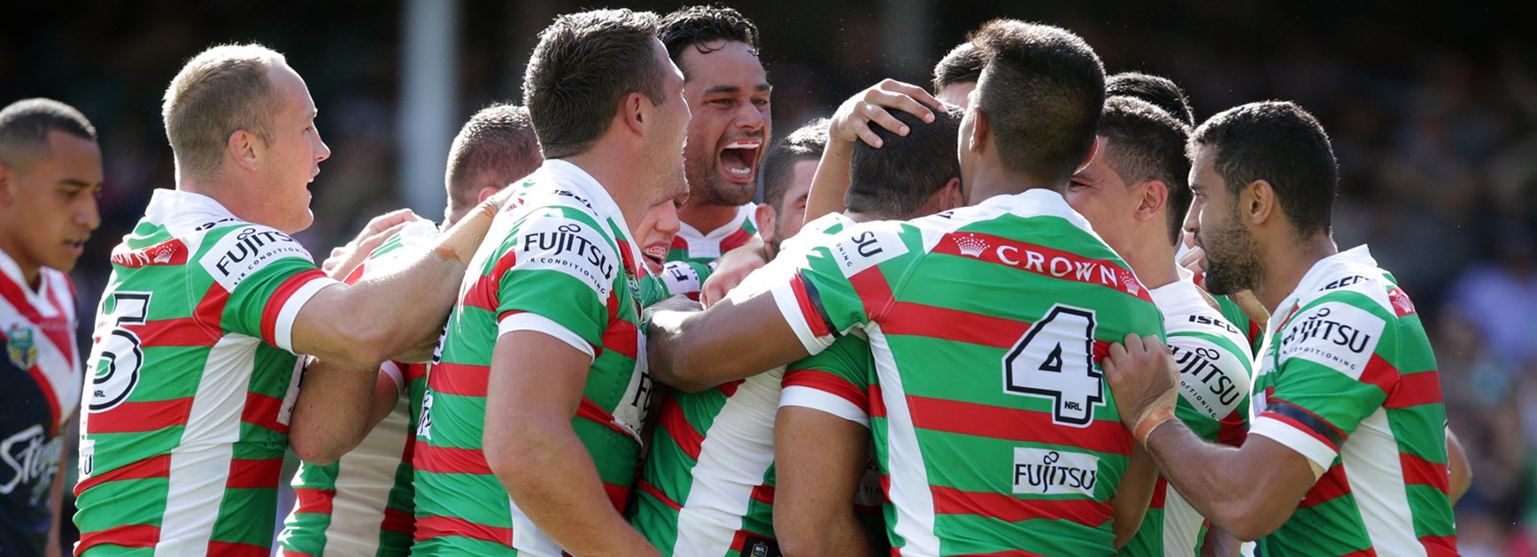 Rabbitohs players celebrate during their big win over the Roosters in Round 1.