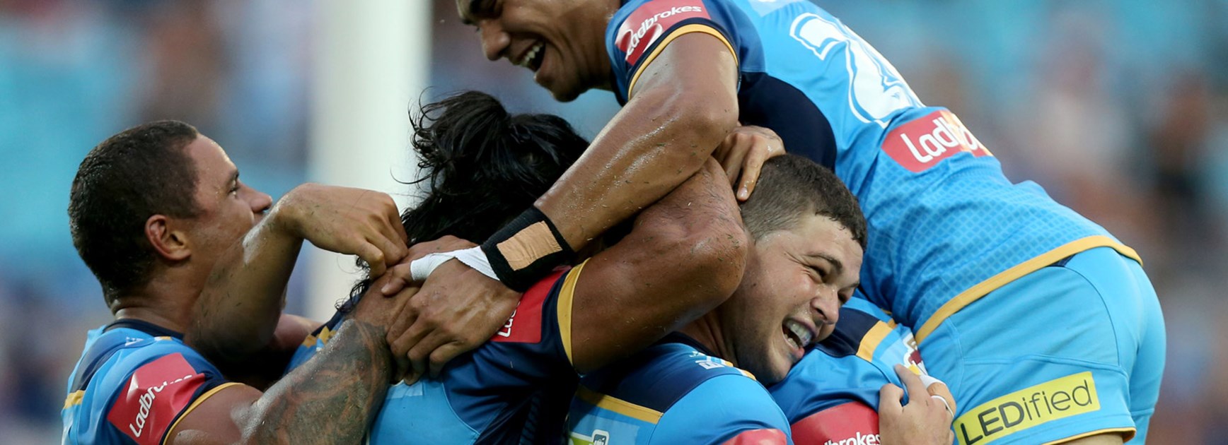 Titans players celebrate a try against the Knights in Round 1.