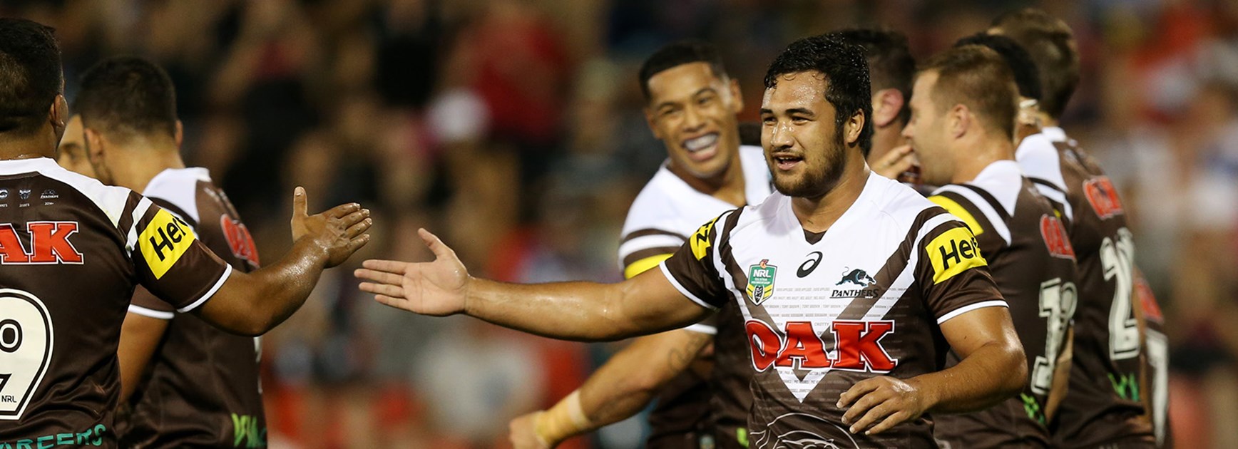 Peta Hiku celebrates with Panthers teammates after scoring a try against the Bulldogs in Round 2.