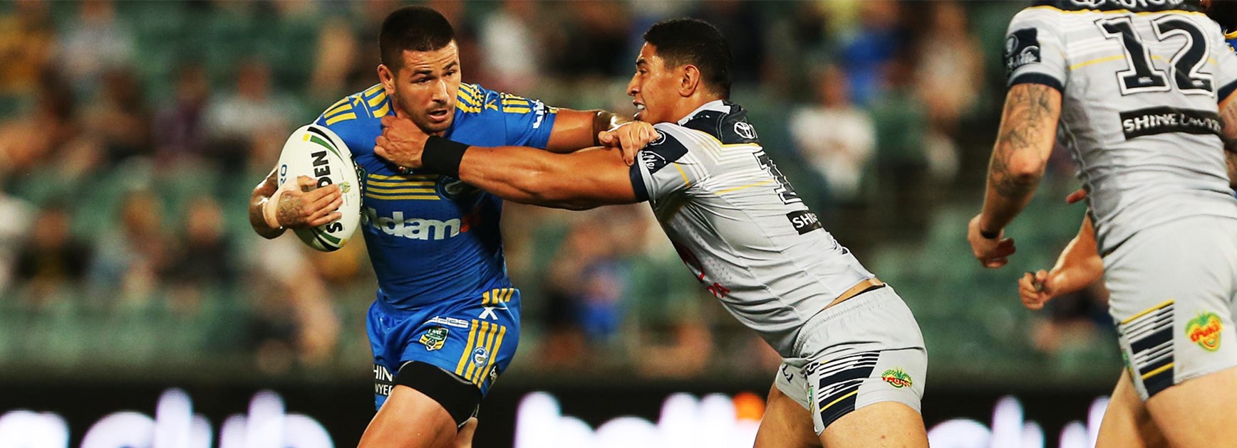 Nathan Peats attempts to shrug off a tackle from Jason Taumalolo in Round 2.