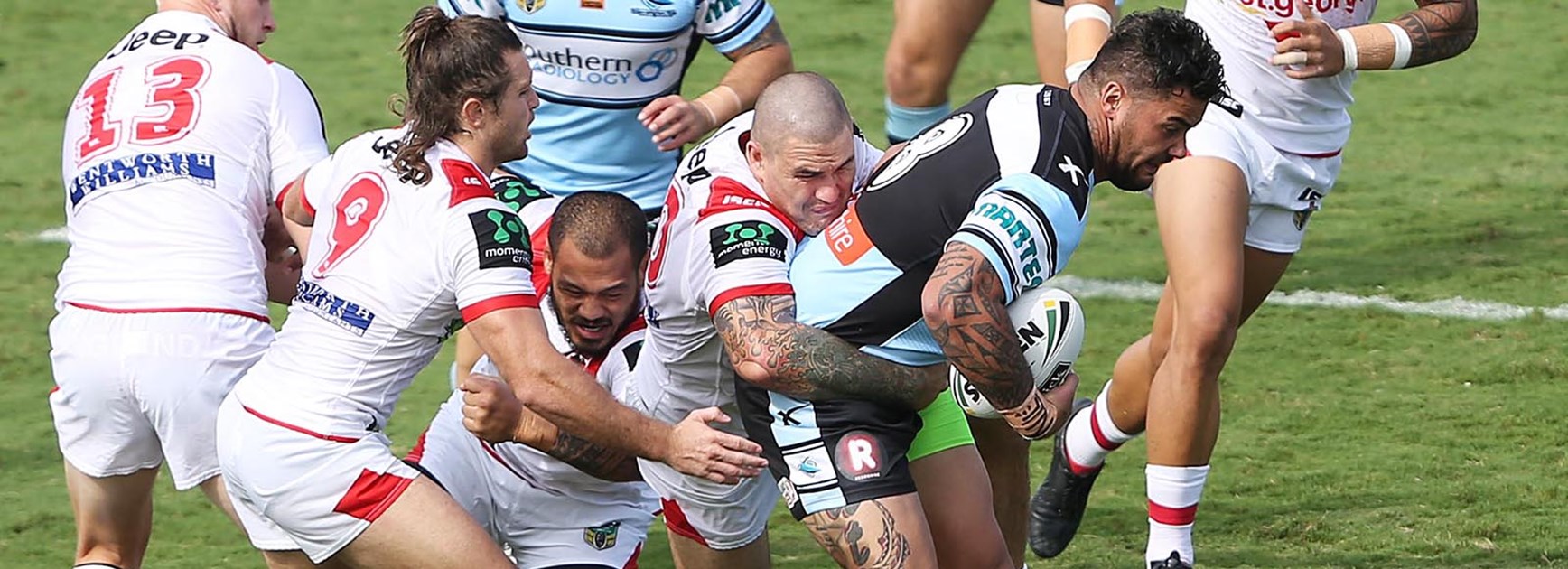 Andrew Fifita carries the Dragons defence several metres in a typically barnstorming run.