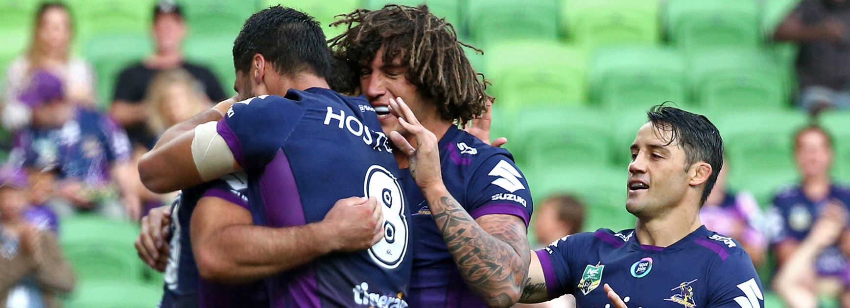 Melbourne Storm celebrate a try against the Titans at AAMI Park in Round 2.