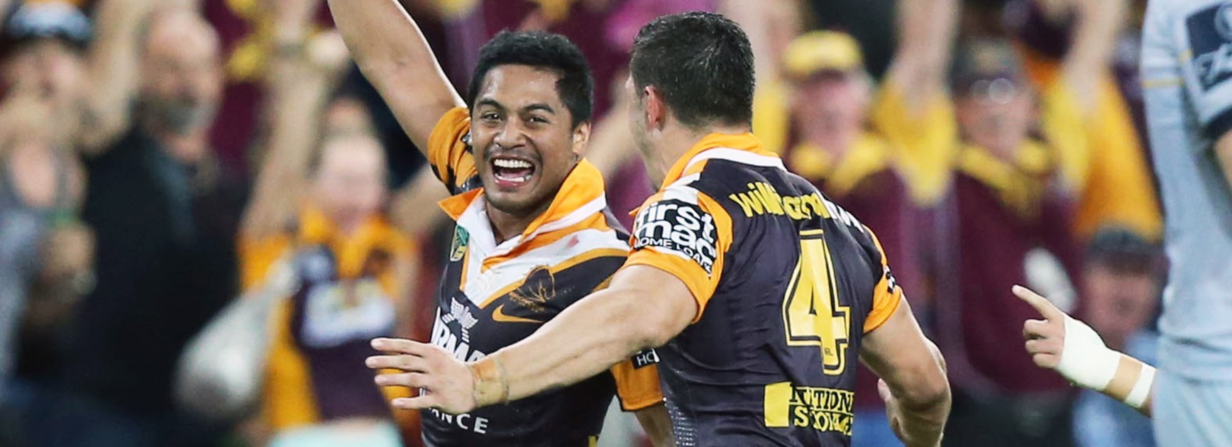 Broncos stars Anthony Milford and James Roberts celebrate.