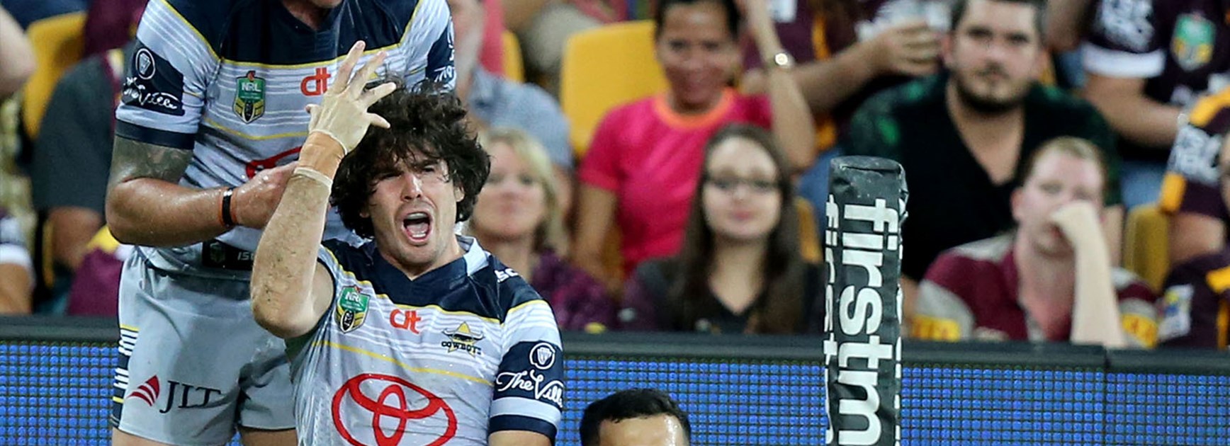 Jake Granville celebrates his side's first try against the Broncos at Suncorp Stadium.
