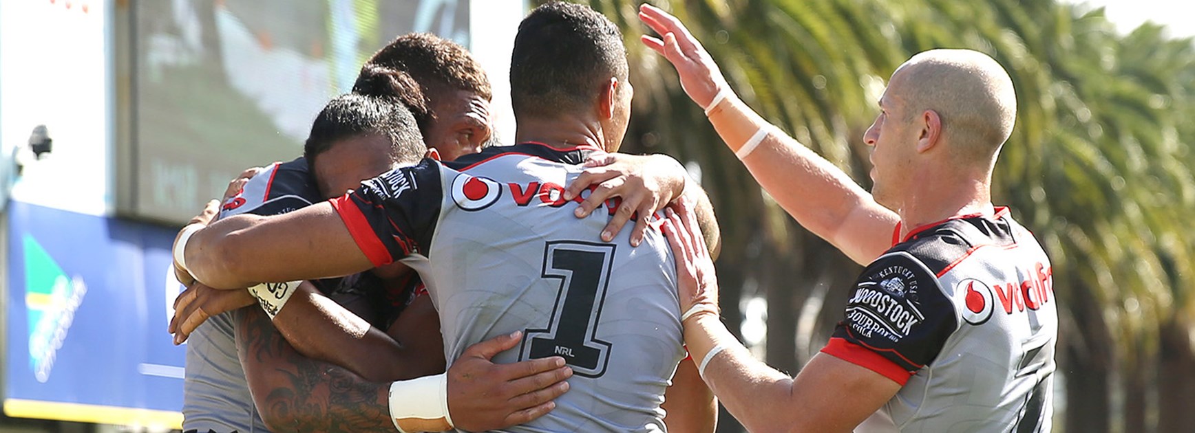 Warriors players celebrate a try against the Roosters in Round 5.