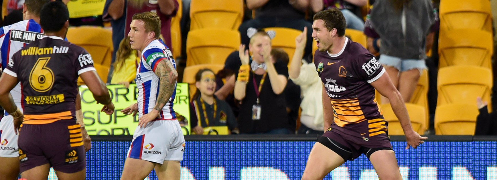 Broncos winger Corey Oates celebrates a try against the Knights.