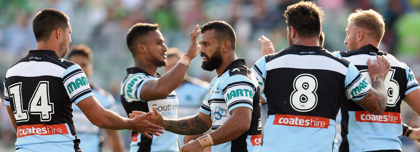 Sharks players celebrate during their win over the Raiders in Round 7.