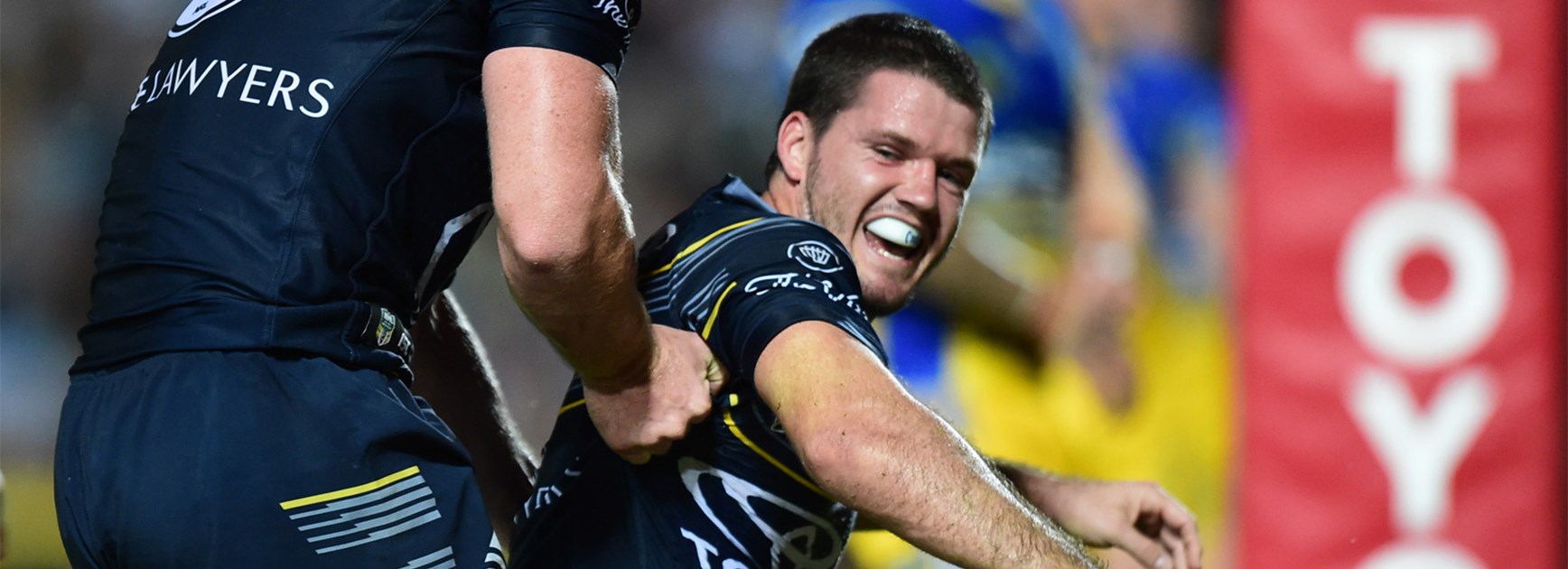 Lachlan Coote celebrates a try during another excellent performance for the Cowboys on Saturday.