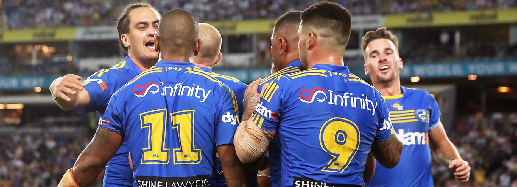 Eels players celebrate a try against the Bulldogs in Round 9.