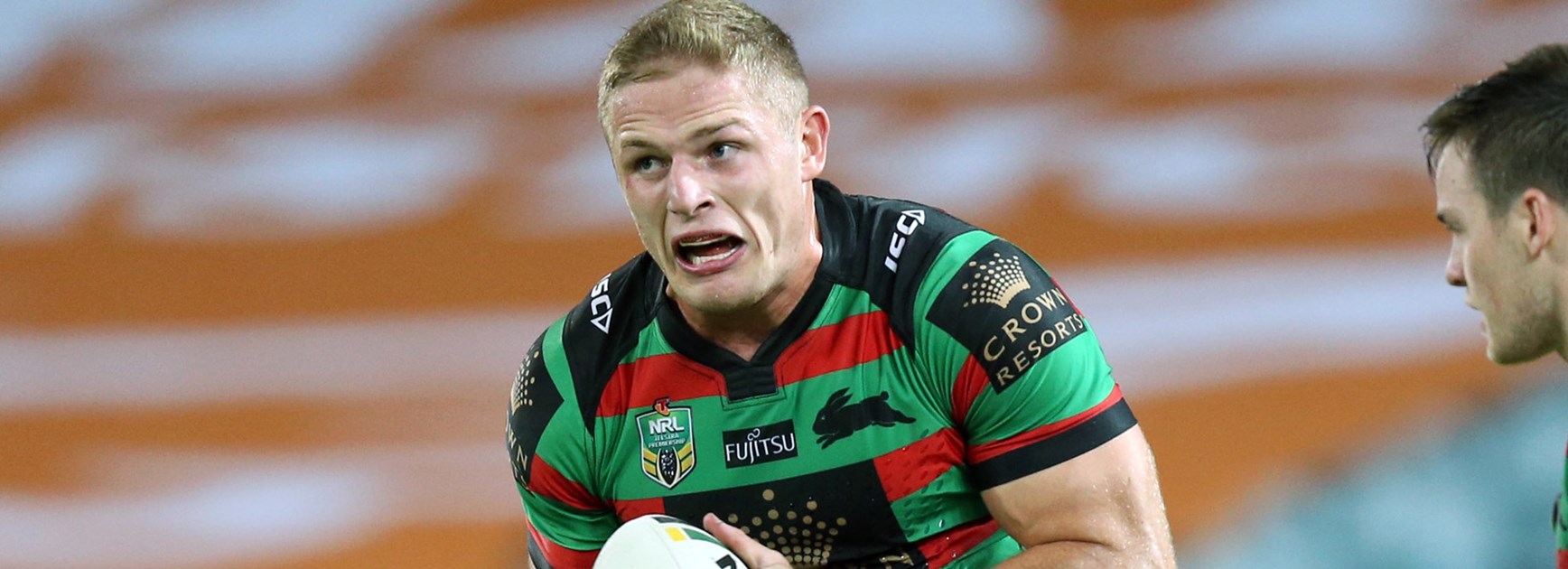 Rabbitohs prop George Burgess charges forward against Wests Tigers.