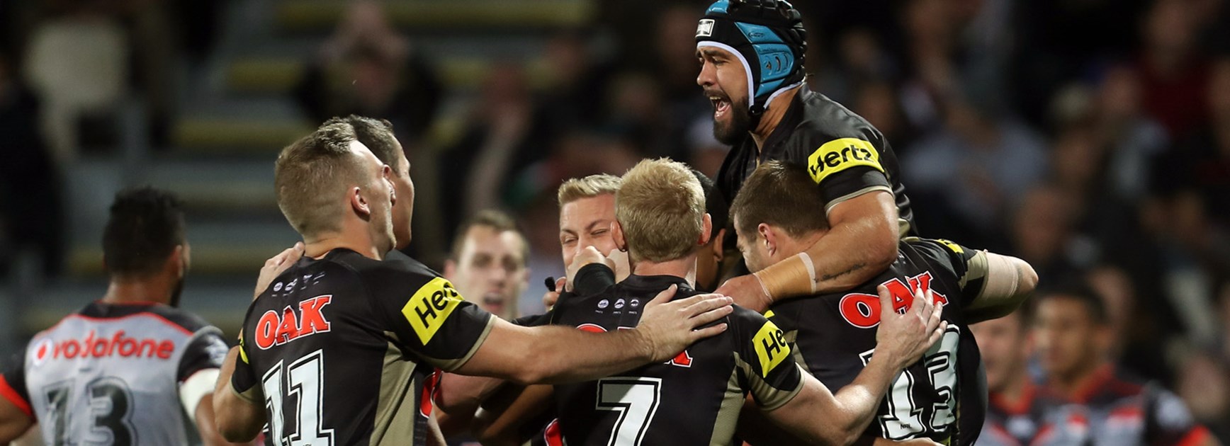 Panthers players celebrate against the Warriors in Round 10.